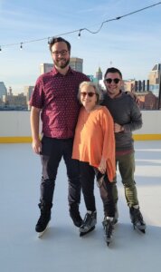 Photo of Kevin Docherty, Sharon Krevor-Weisbaum, and Anthony May on ice skating rink