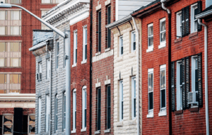An image looking down a line of Baltimore rowhomes.